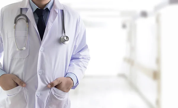 Closeup Doctor in blurred of hospital colleague and hand holding — Stock Photo, Image