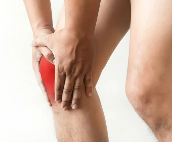 The knee man holds on suffering from pain in knee Closeup. The l — Stock Photo, Image