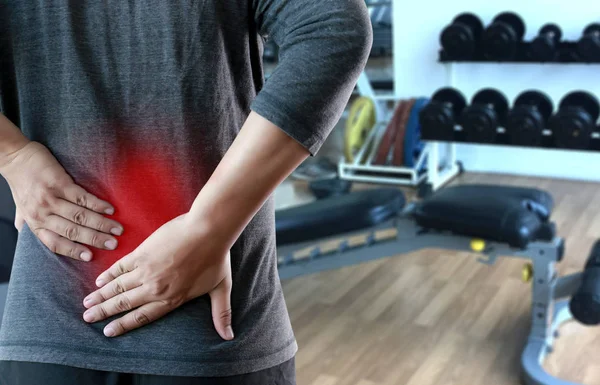 Young man Feeling suffering  Lower back pain  Pain relief concep — Stock Photo, Image