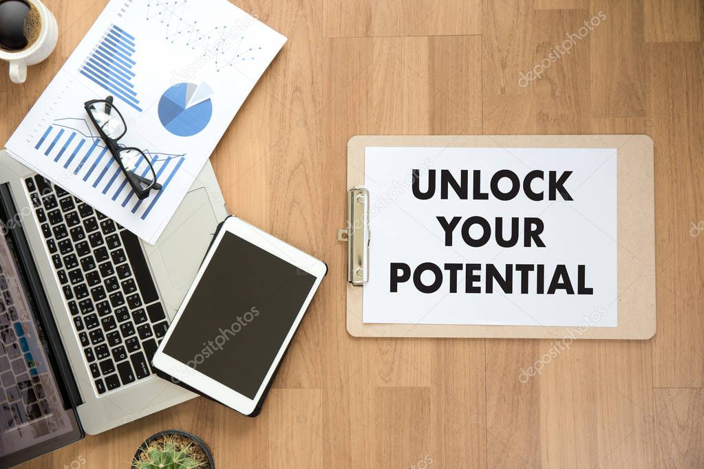 UNLOCK YOUR POTENTIAL  businessman hand working concept for GROW