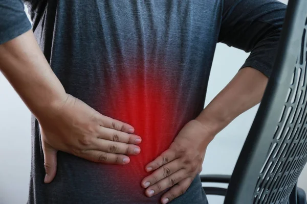 Young man Feeling suffering  Lower back pain  Pain relief concep — Stock Photo, Image