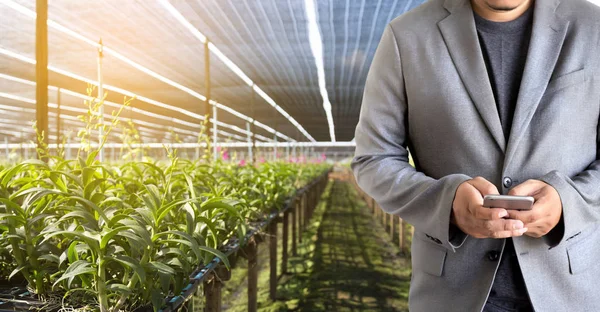 agriculture technology concept man Agronomist Using a Tablet in