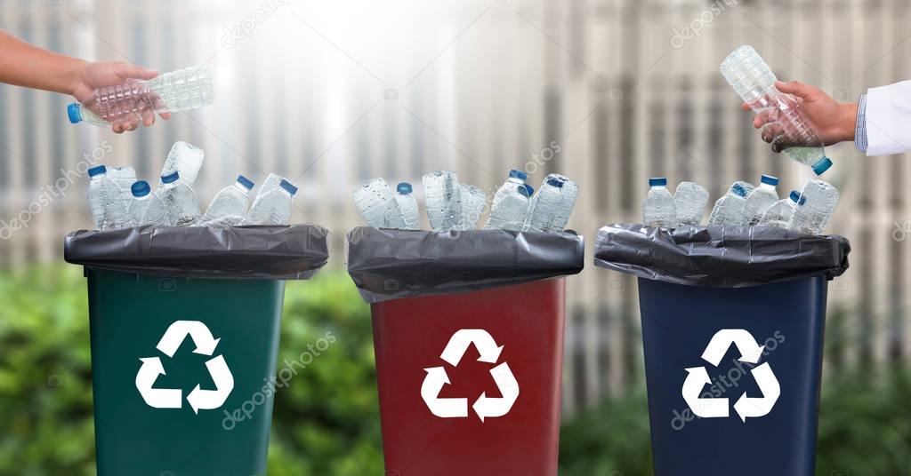 man hand putting plastic reuse  for recycling concept environmen