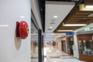 Fire alarm on the wall of shopping mall warning and security sys clipart