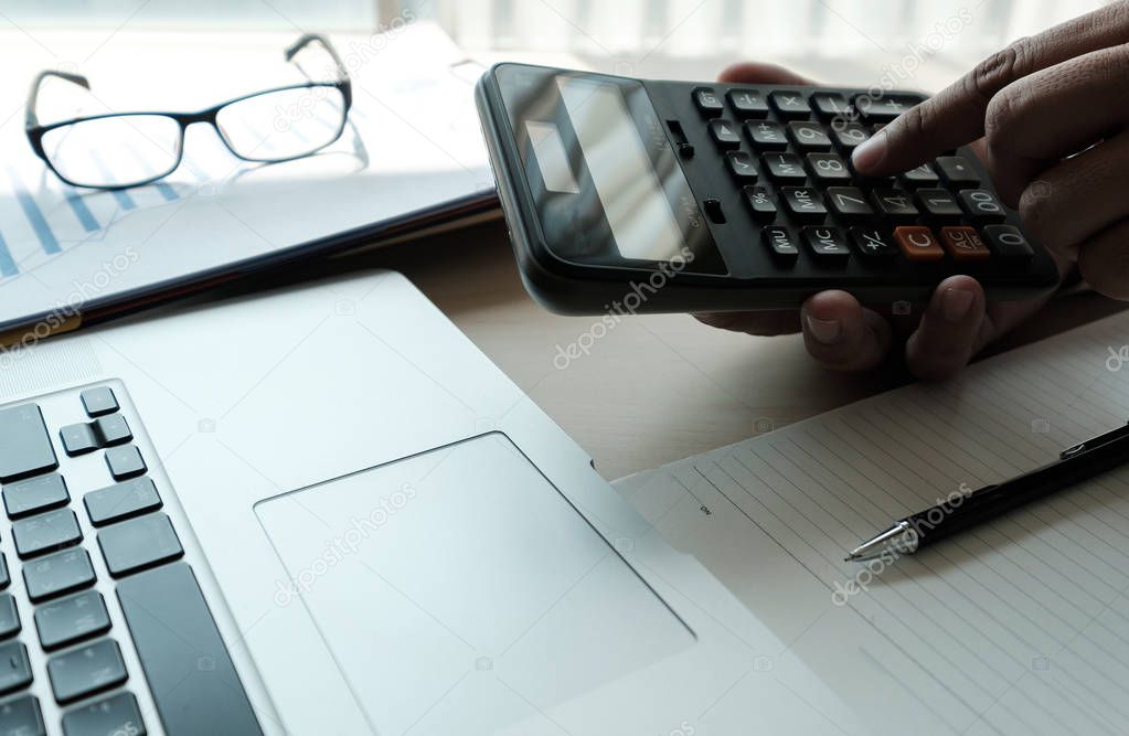 Close up businessman using calculator on documents Unrecognizabl