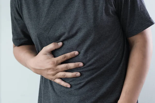 Man stomach suffering and having a stomachache — Stock Photo, Image