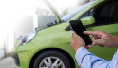 man Using a mobile phone call to  assistance Help with a broken 