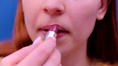 Woman applying lipstick. beauty concept closeup 4k