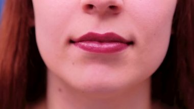 Slow motion Smiling female mouth with ideal white teeth. Close up of smiling woman face with perfect smile. White teeth smile concept