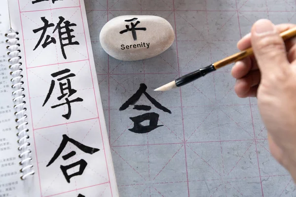 Traveller learn to write Chinese characters, calligraphy is the traditional culture of China