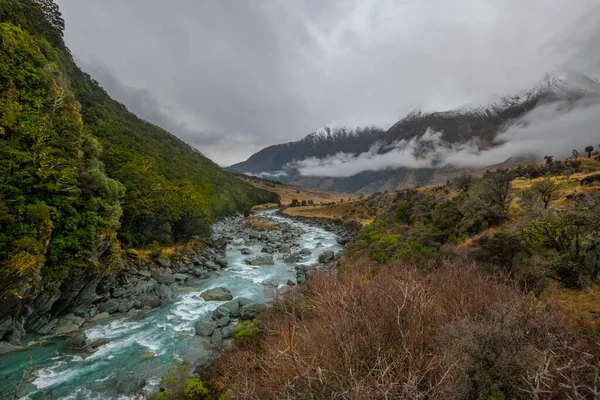 Snow peak with river in south island, New Zealand. Photograph in winter 2019.