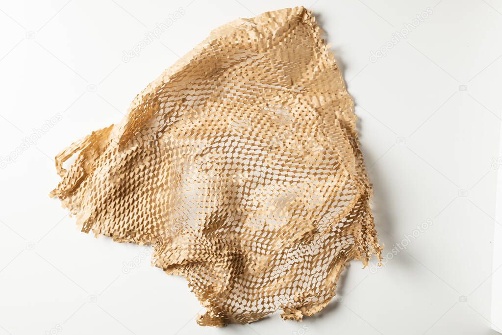 Brown crumpled paper isolated on white background. Ecology concept, reuse, recycle.