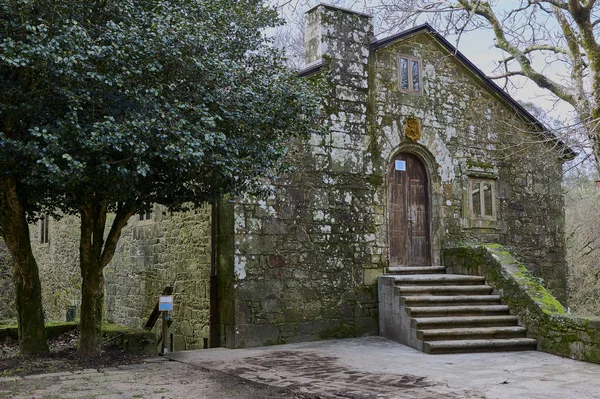 Stone house in a forest. Accommodation for pilgrims near a monastery. The house is made of stone, typical of the region of Galicia, in the northwest of Spain.
