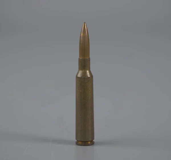 Golden gun bullet placed on a table