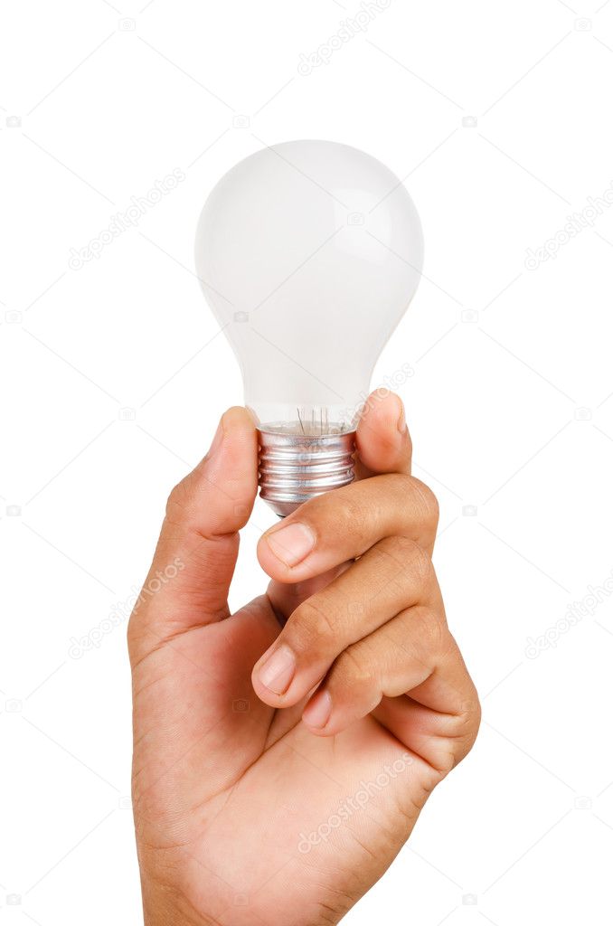Hand holding an incandescent light bulb.