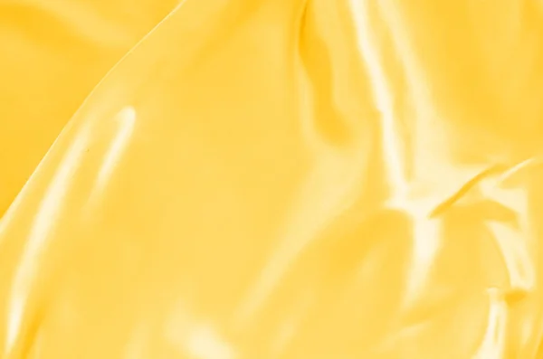 Textura de seda de tecido de ouro para fundo — Fotografia de Stock