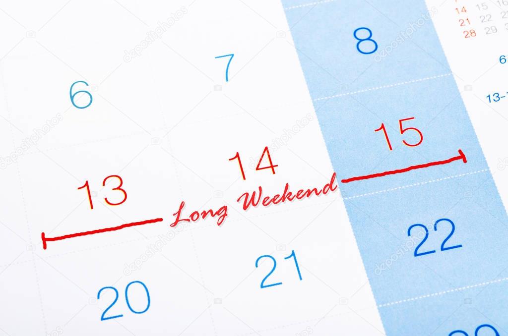 Long Weekend on calendar page. — Stock Photo © gamjai 140299386