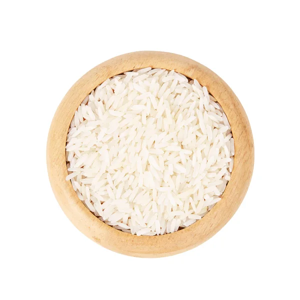 Ahşap tabak içinde çiğ beyaz pirinç. — Stok fotoğraf