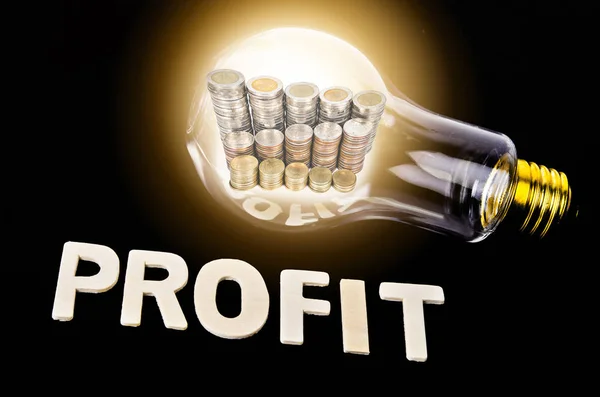 Profit Glowing light bulb. — Stock Photo, Image