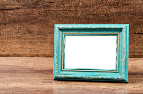 Blauer leerer Fotorahmen auf Holzzimmer. — Stockfoto