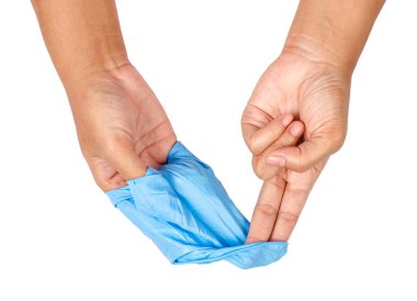 Uzak mavi tek kullanımlık eldiven atma el.