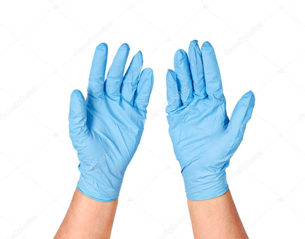 Hands putting on protective blue gloves.