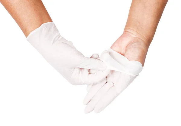 Main jetant des gants jetables blancs médicaux . — Photo