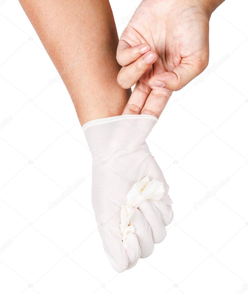 Hand throwing away white disposable gloves medical.