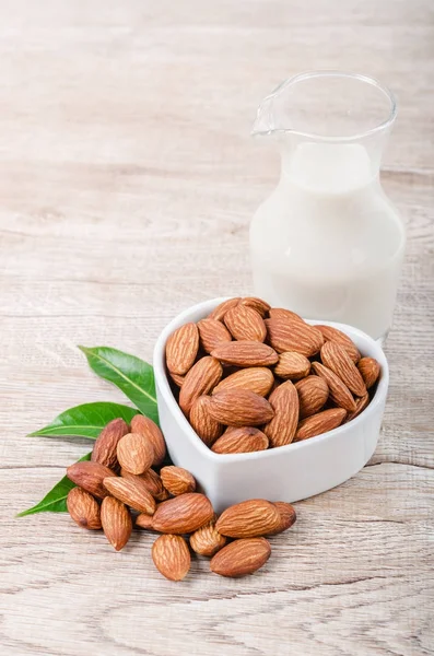 Almond milk in bottle with almond. — Stock Photo, Image