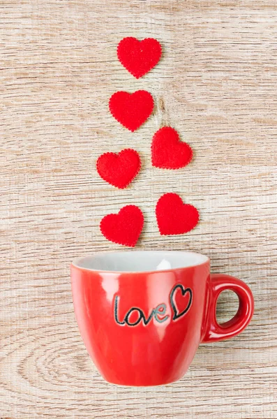 Red heart with red coffee cup.