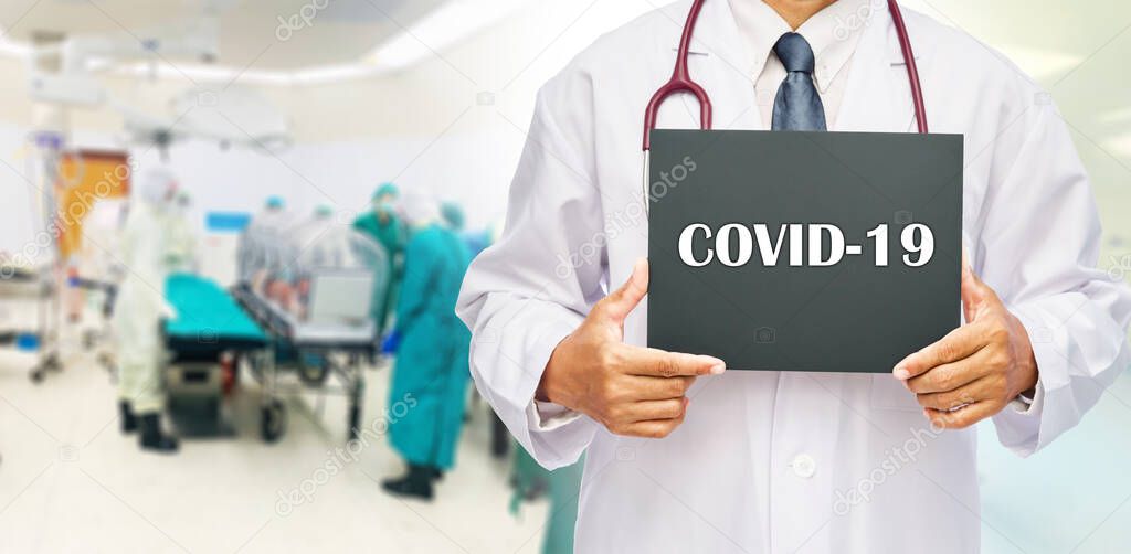 Doctor and transfer coronavirus covid-19 disease infected patient in isolation capsule.