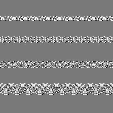 Beyaz dantel kurdeleler kümesi