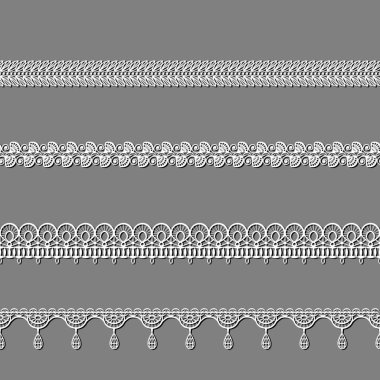 Beyaz dantel kurdeleler kümesi