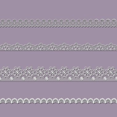 Beyaz dantel kurdeleler kümesi