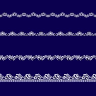 Beyaz dantel kurdeleler kümesi