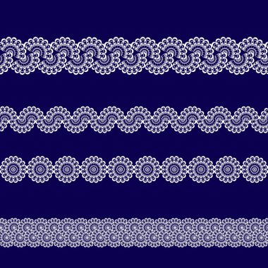 Beyaz dantel kurdeleler kümesi