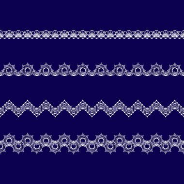 Beyaz dantel kurdeleler kümesi