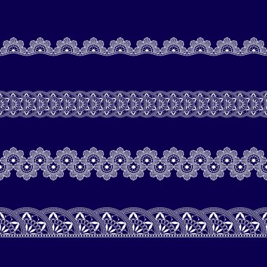 Beyaz dantel kurdeleler kümesi