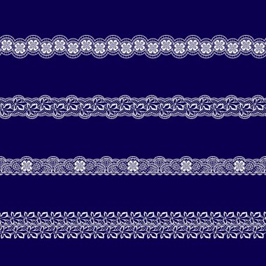 Beyaz dantel kurdeleler kümesi