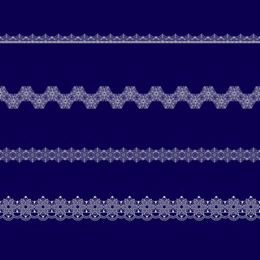 Beyaz dantel kurdeleler kümesi