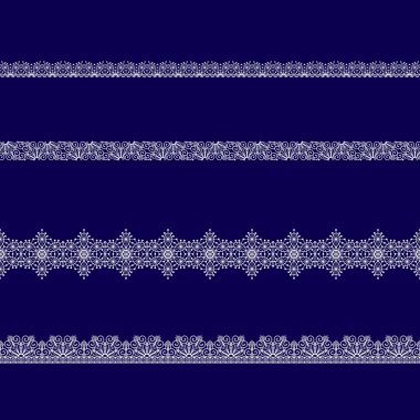 Beyaz dantel kurdeleler kümesi