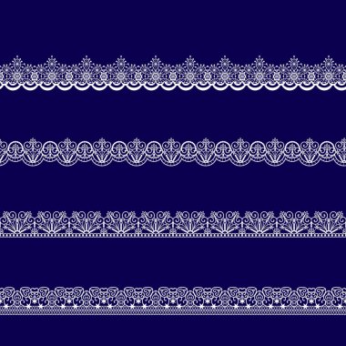 Beyaz dantel kurdeleler kümesi