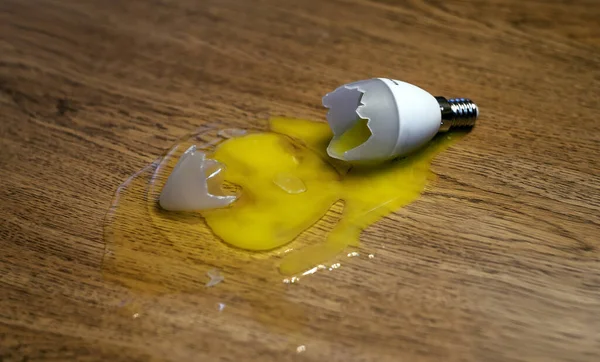 A light bulb broke and an egg leaked out