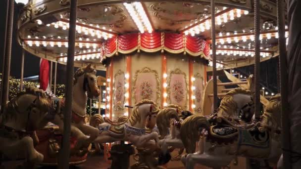 Static frame beautiful Christmas carousel with bright lights and horses. — Stock Video