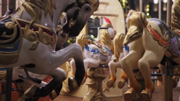 Static frame beautiful Christmas carousel with bright lights and horses. — Stock Video