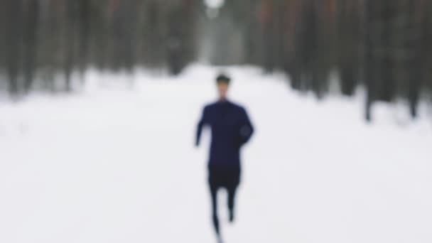Close up portrait of jogger looking determined into camera, medium close. — Stock video