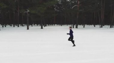 Running Man In Sportswear Workout Before Triathlon.Winter Sports Concept. Aerial