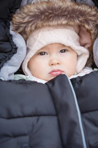 Eight months old baby girl wrapped and dressed in fur and winter — Stock Photo, Image
