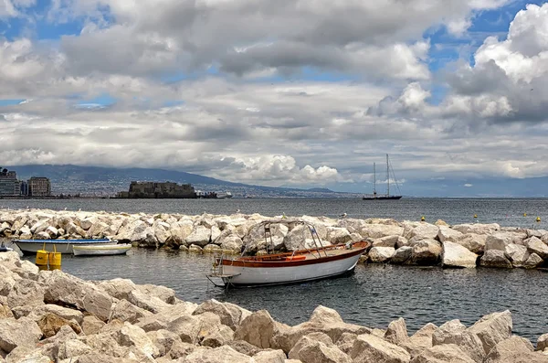 Small boat and landscape with castle in Naples photography — Stockfoto
