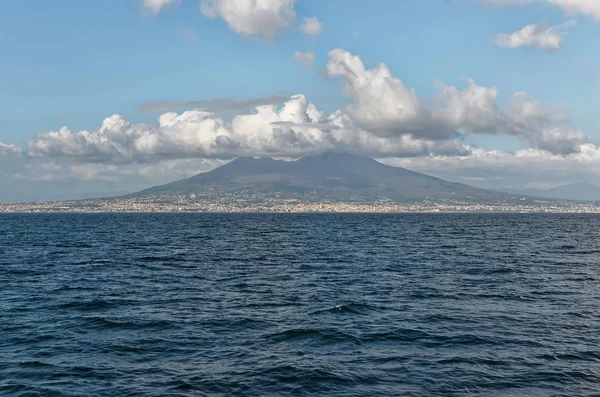 Vesuv in cloudy sky photo from the sea boat — ストック写真